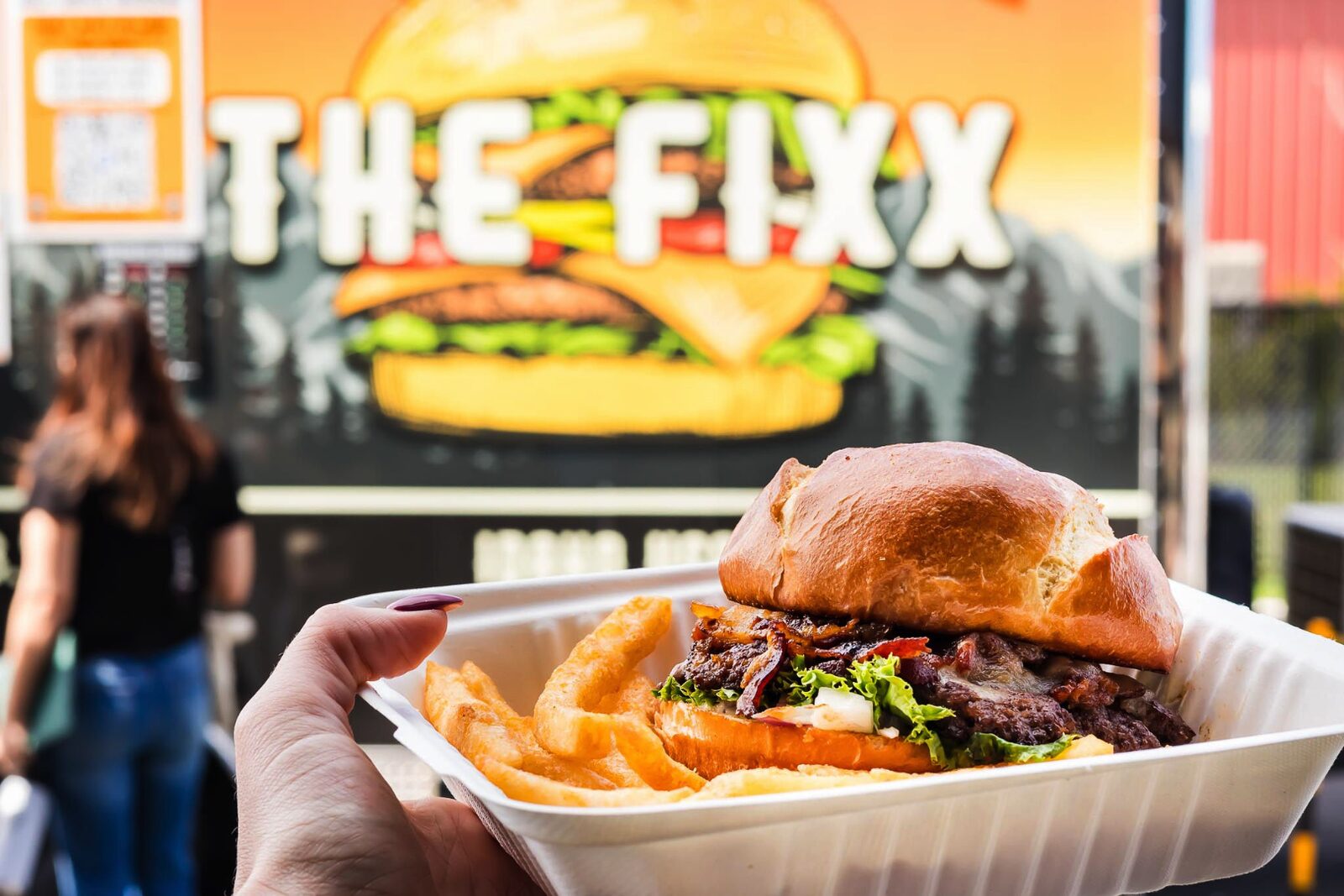 A signature smash burger and crinkle-cut fries served at The Fixx Smash Burgers in front of the food truck at The Post Falls Pavilion in Post Falls, Idaho.